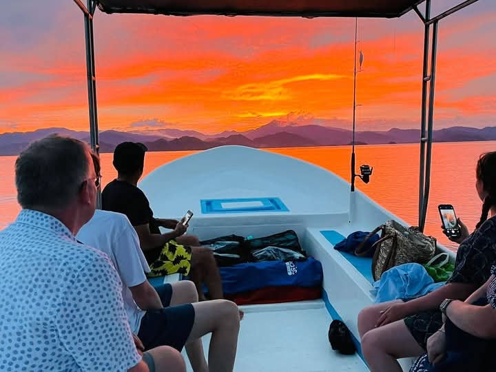 Spectacular fiery sunset over the Gulf of Nicoya from a tour boat